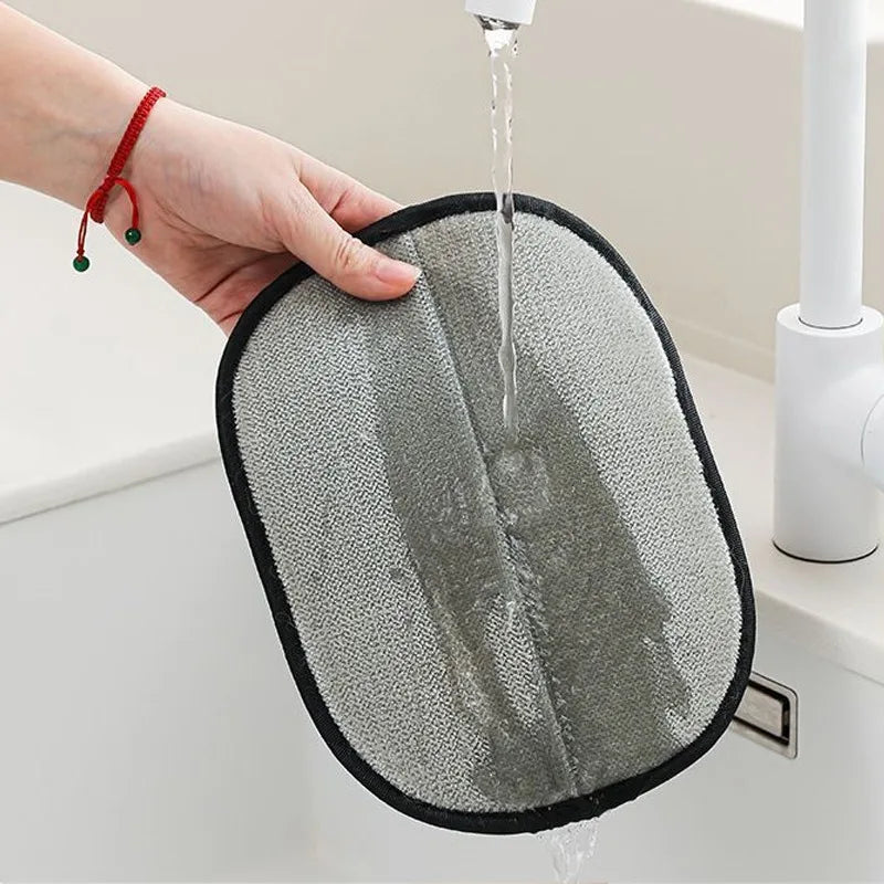 Rinsing the FurAway glove under the tap